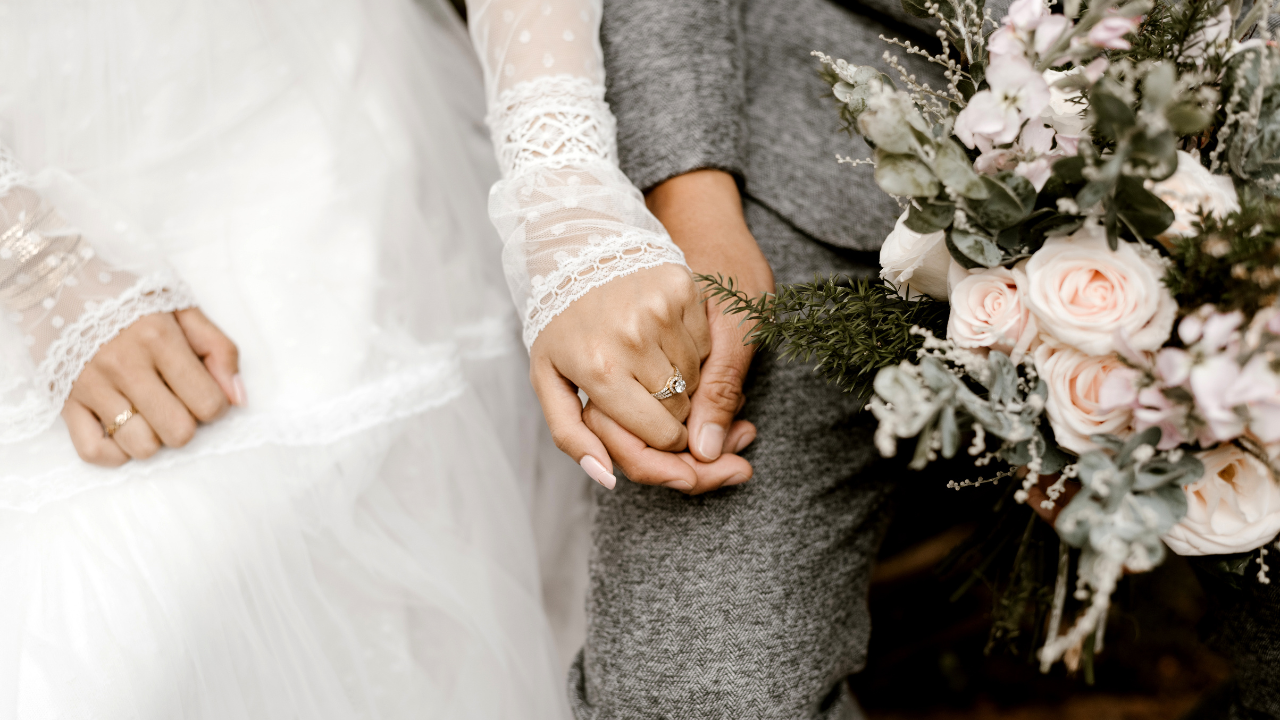 Wedding couple holding hands. Sephton Blog Financial Steps to Take When Blending Families: Before and After “I Do”
