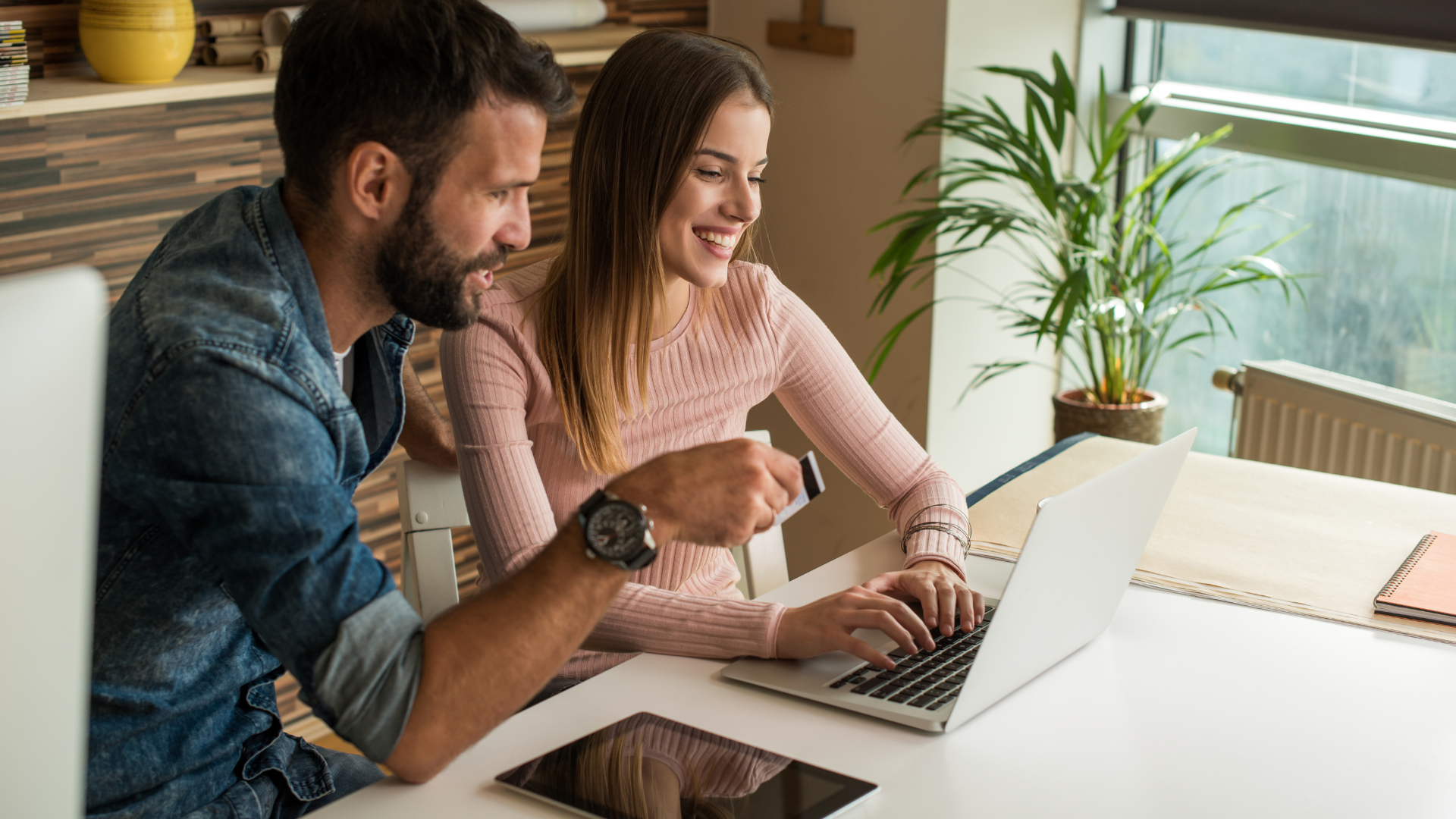 man and woman business owners on computer